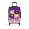 faded pink and purple k.e.Ψ. suitcases